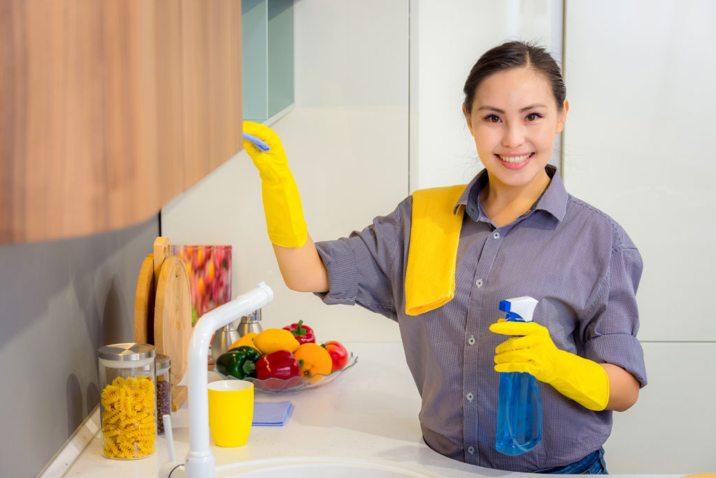 woman cleaning kitchen